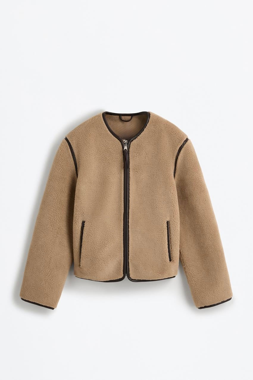 Fur jacket with decorative leather details