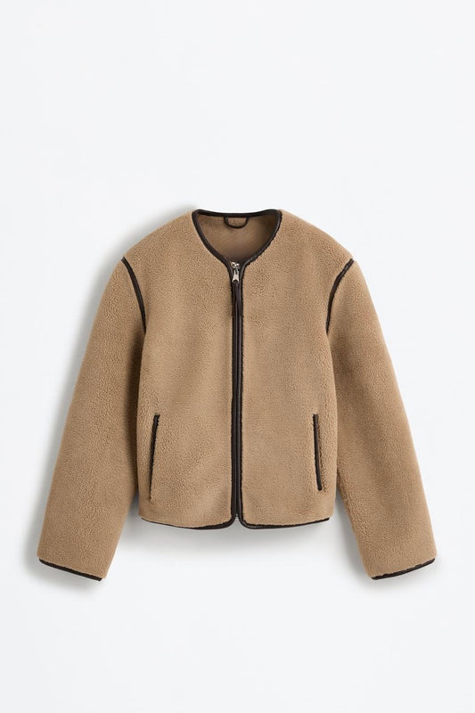 Fur jacket with decorative leather details