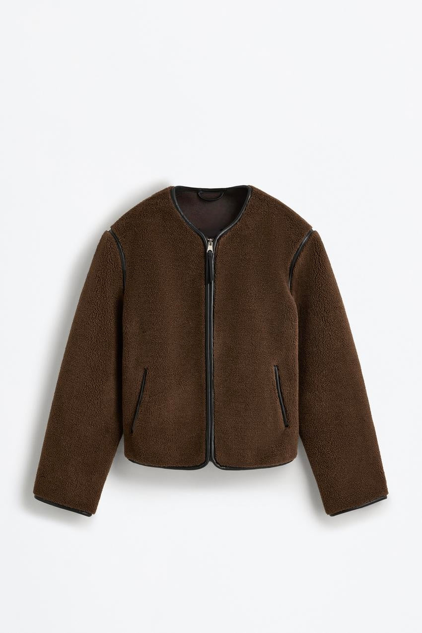 Fur jacket with decorative leather details